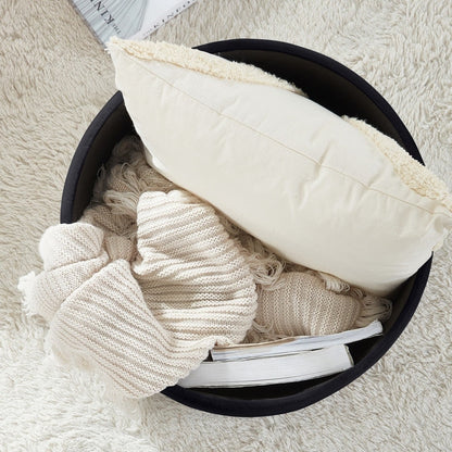 Pouf de rangement rond capitonné Donovan