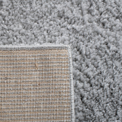 Tapis SAFAVIEH August Wilhelma Shag uni de 3 cm d'épaisseur