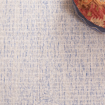 Tapis en laine moderne abstrait fait main SAFAVIEH Maggy