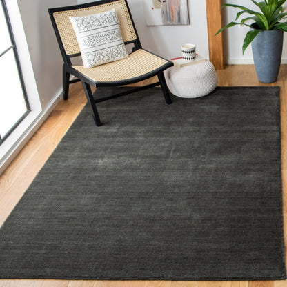 Tapis moderne en laine fait main SAFAVIEH avec bordure en palmier de l'Himalaya