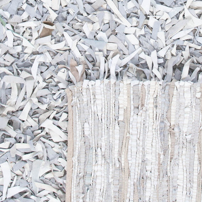 SAFAVIEH Tapis en cuir moderne à poils longs Blayne fait à la main