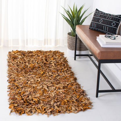 Tapis décoratif moderne SAFAVIEH en cuir shaggy fait main Doinita