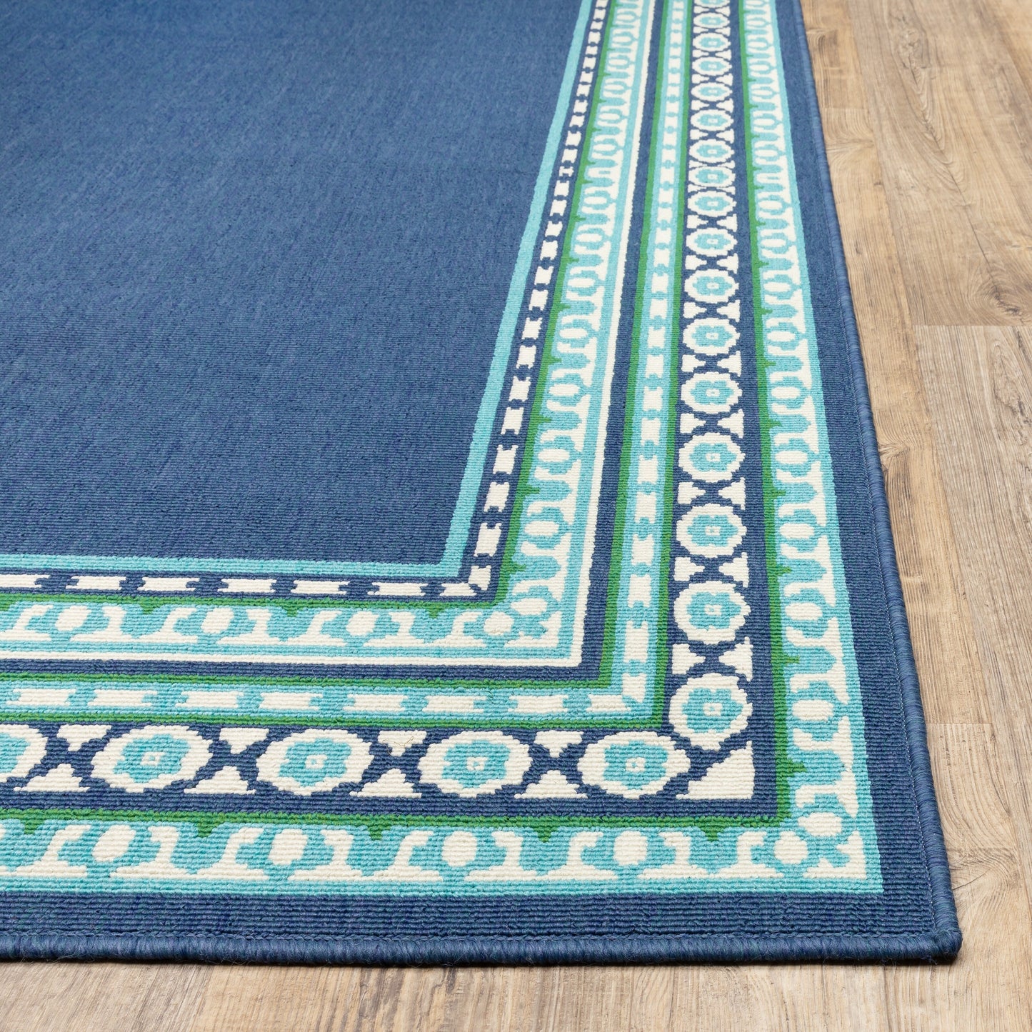 Tapis d'intérieur/extérieur Style Haven Martinque à bordure verte bleu marine ~