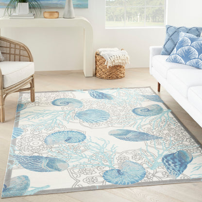 Tapis d'intérieur et d'extérieur Waverly Sun &amp; Shade Shore Thing à motif de coquillages tropicaux et floraux
