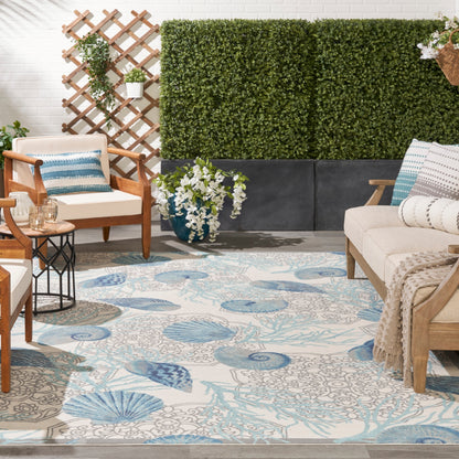 Tapis d'intérieur et d'extérieur Waverly Sun &amp; Shade Shore Thing à motif de coquillages tropicaux et floraux