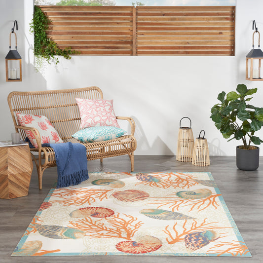 Tapis d'intérieur et d'extérieur Waverly Sun &amp; Shade Shore Thing à motif de coquillages tropicaux et floraux